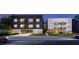 Modern apartment building with parking and balconies at 711 E Lenoir St # 207, Raleigh, NC 27601