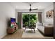 Comfortable living room with a sectional sofa and a large flat-screen TV at 711 E Lenoir St # 207, Raleigh, NC 27601