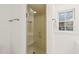 Glass shower stall with marble-style walls and built-in seat at 7304 Wilderness Rd, Raleigh, NC 27613