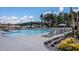 Inviting community pool with ample lounge chairs and umbrellas at 769 Denburn Pl, Raleigh, NC 27603