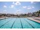 Large community pool with plenty of lounge chairs and umbrellas at 769 Denburn Pl, Raleigh, NC 27603