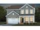 Two-story house with gray siding, white garage door, and landscaping at 769 Denburn Pl, Raleigh, NC 27603