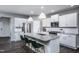 Spacious kitchen featuring white cabinets, granite countertops, and an island at 769 Denburn Pl, Raleigh, NC 27603