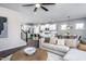 Bright living room with sectional sofa and a view of the kitchen and dining area at 769 Denburn Pl, Raleigh, NC 27603