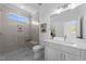 Contemporary bathroom features a glass shower and modern vanity with white countertop at 8001 Wexford Waters Ln, Wake Forest, NC 27587
