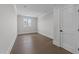 Empty bedroom with wood floors, fresh paint, and natural lighting at 8001 Wexford Waters Ln, Wake Forest, NC 27587