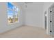 Bedroom showcasing a large window with natural light and a ceiling fan at 8001 Wexford Waters Ln, Wake Forest, NC 27587