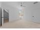 Bright bedroom features neutral carpet, corner windows, ceiling fan, and access to a closet at 8001 Wexford Waters Ln, Wake Forest, NC 27587