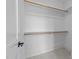 Walk-in closet featuring wooden rods for hanging clothes at 8001 Wexford Waters Ln, Wake Forest, NC 27587