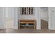 Hallway view featuring a built-in desk with seating and modern decor at 8001 Wexford Waters Ln, Wake Forest, NC 27587