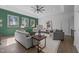 Spacious living room features stylish decor, comfortable seating, and plenty of light at 8001 Wexford Waters Ln, Wake Forest, NC 27587