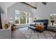 Main bedroom with large windows, trey ceiling, and sitting area at 8001 Wexford Waters Ln, Wake Forest, NC 27587