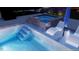 Close up of a new pool design featuring steps, lounge chairs, and spa at 8001 Wexford Waters Ln, Wake Forest, NC 27587