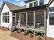 Back porch showing stairs and ceiling fan at 8001 Wexford Waters Ln, Wake Forest, NC 27587