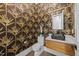 Stylish powder room features decorative wallpaper, modern sink, and elegant fixtures at 8001 Wexford Waters Ln, Wake Forest, NC 27587