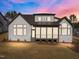 Rear exterior of home with screened porch at 8001 Wexford Waters Ln, Wake Forest, NC 27587