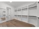 Walk-in closet with custom shelving and ample storage space at 8001 Wexford Waters Ln, Wake Forest, NC 27587