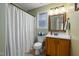 Clean bathroom with shower/tub and wood vanity at 1006 Silent Retreat Ln, Knightdale, NC 27545