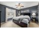 Spacious bedroom with large window and ceiling fan at 1006 Silent Retreat Ln, Knightdale, NC 27545