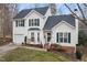 Two-story house with attached garage and brick accents at 1006 Silent Retreat Ln, Knightdale, NC 27545