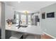 Kitchen boasts white cabinets, a large island, and a breakfast bar at 1006 Silent Retreat Ln, Knightdale, NC 27545