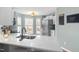 Modern kitchen with white cabinets, stainless steel appliances and breakfast bar at 1006 Silent Retreat Ln, Knightdale, NC 27545