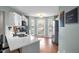 Modern kitchen with white cabinets, stainless steel appliances, and quartz countertops at 1006 Silent Retreat Ln, Knightdale, NC 27545