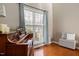 Living room corner with piano and large window at 1006 Silent Retreat Ln, Knightdale, NC 27545