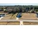 Spacious two-story home with a two-car garage and expansive front yard, near a wooded area at 105 Langdon Chase Way, Selma, NC 27576