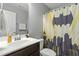 This bathroom features a large mirror, vanity and an awesome Batman-themed shower curtain at 105 Langdon Chase Way, Selma, NC 27576