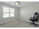 This bedroom features a ceiling fan, neutral paint, carpet and a window for natural light at 105 Langdon Chase Way, Selma, NC 27576