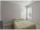 Minimalist bedroom with neutral walls, large window, and a comfortable bed at 105 Langdon Chase Way, Selma, NC 27576