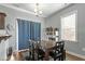 Cozy dining area with a wooden table, chairs, and a window offering natural light at 105 Langdon Chase Way, Selma, NC 27576