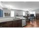 Open kitchen with granite countertops and a view into the adjacent living room at 105 Langdon Chase Way, Selma, NC 27576