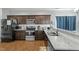 Bright kitchen features granite countertops, stainless steel appliances, and ample cabinet space at 105 Langdon Chase Way, Selma, NC 27576