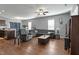 Comfortable living room with plush seating, ceiling fan, and hardwood floors at 105 Langdon Chase Way, Selma, NC 27576