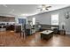 Open-concept living room connected to the kitchen, featuring hardwood floors and ample seating at 105 Langdon Chase Way, Selma, NC 27576