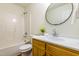 Bathroom with vanity, round mirror, and shower/tub combo at 125 Havencrest Lndg, Garner, NC 27529