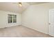 Bright bedroom with ceiling fan and large window at 125 Havencrest Lndg, Garner, NC 27529