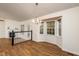 Open dining room with hardwood floors, a fireplace and access to deck at 125 Havencrest Lndg, Garner, NC 27529