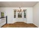Bright dining room features a bay window and elegant chandelier at 125 Havencrest Lndg, Garner, NC 27529