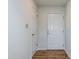 Simple entryway with hardwood floors and white doors at 125 Havencrest Lndg, Garner, NC 27529
