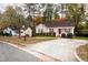 Tan house with red door and small front yard at 125 Havencrest Lndg, Garner, NC 27529