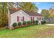 Tan house with red shutters and landscaping at 125 Havencrest Lndg, Garner, NC 27529