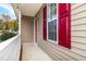Front porch with red shutters and white railing at 125 Havencrest Lndg, Garner, NC 27529