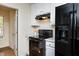 Black appliances and white cabinets in kitchen at 125 Havencrest Lndg, Garner, NC 27529