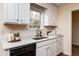 White cabinets, quartz countertops, and black appliances at 125 Havencrest Lndg, Garner, NC 27529