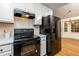 Black appliances, white cabinets, and quartz countertops at 125 Havencrest Lndg, Garner, NC 27529
