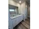 Bathroom with double sinks, granite countertop, and a separate shower at 128 Pate Landing Dr, Selma, NC 27576