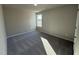 Bright bedroom featuring a large window and carpet flooring at 128 Pate Landing Dr, Selma, NC 27576
